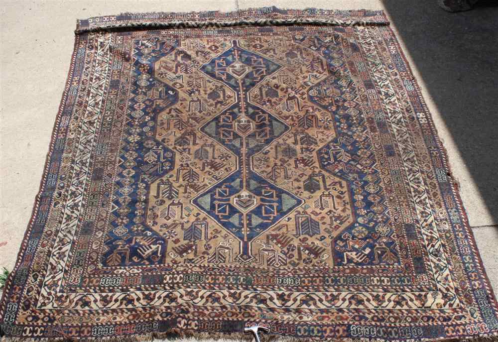 Appraisal: ANTIQUE THREE MEDALLION TRIBAL RUG in navy taupe brown rust