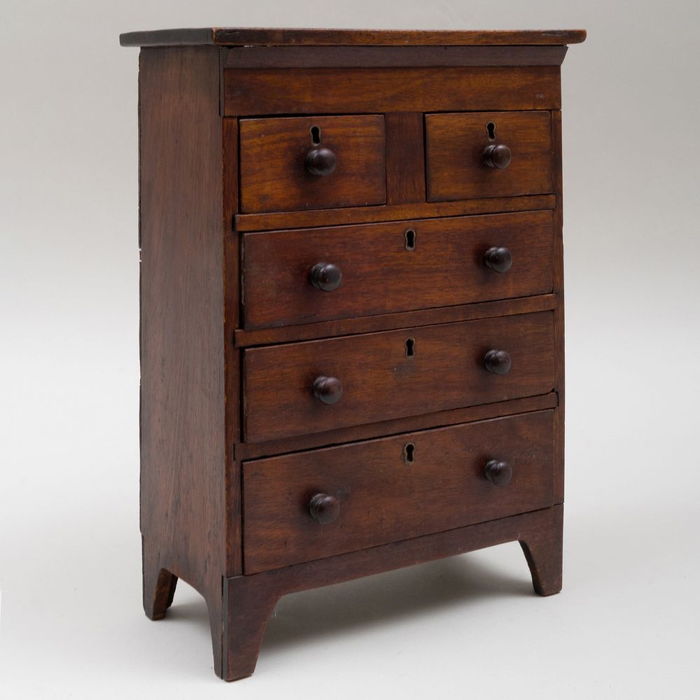 Appraisal: Miniature Stained Wood Chest of Drawers x x in An