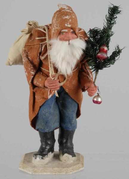 Appraisal: Composition Belsnickel Santa Description Marked Germany Carrying fir tree and