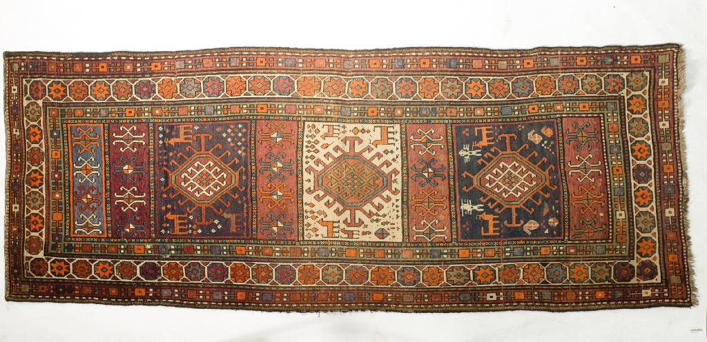 Appraisal: KAZAK RUNNER EARLY th CENTURY central panel with a cream