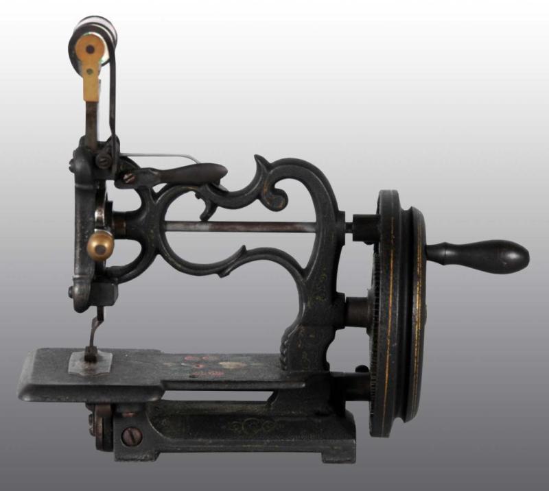 Appraisal: Cast Iron Child's Toy Sewing Machine Description By Charles Raymond