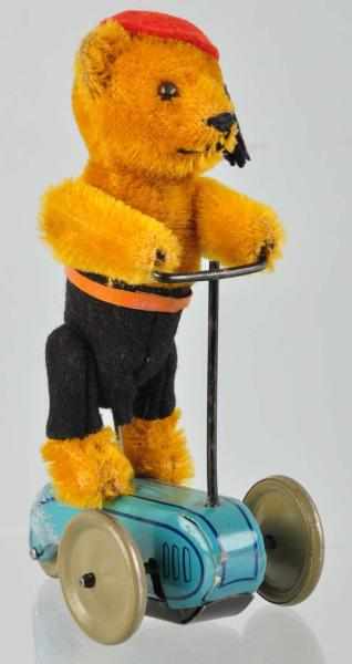 Appraisal: Schuco Bear on Scooter Wind-Up Toy German Working Includes original