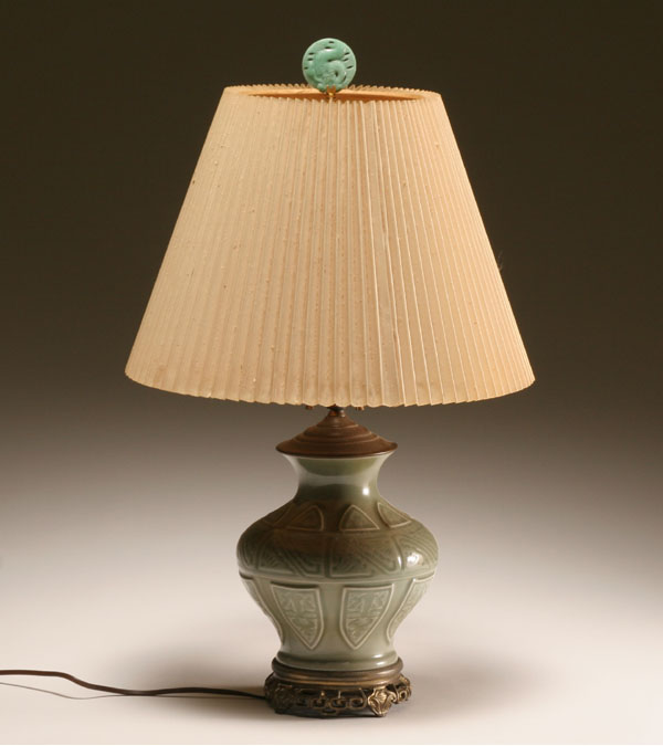 Appraisal: Chinese celadon glazed table lamp repeating geometric design figural finial