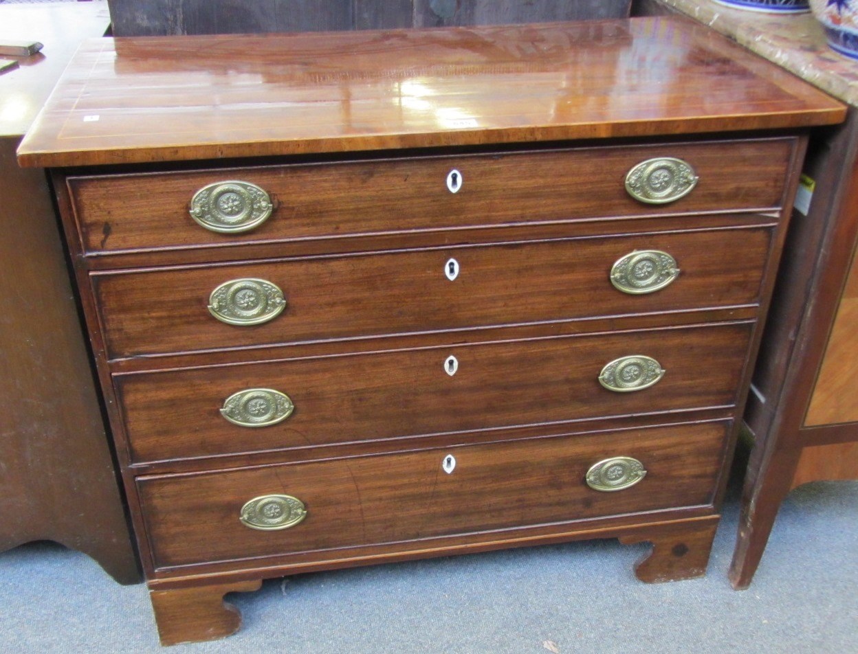 Appraisal: A George III inlaid mahogany chest of four long graduated