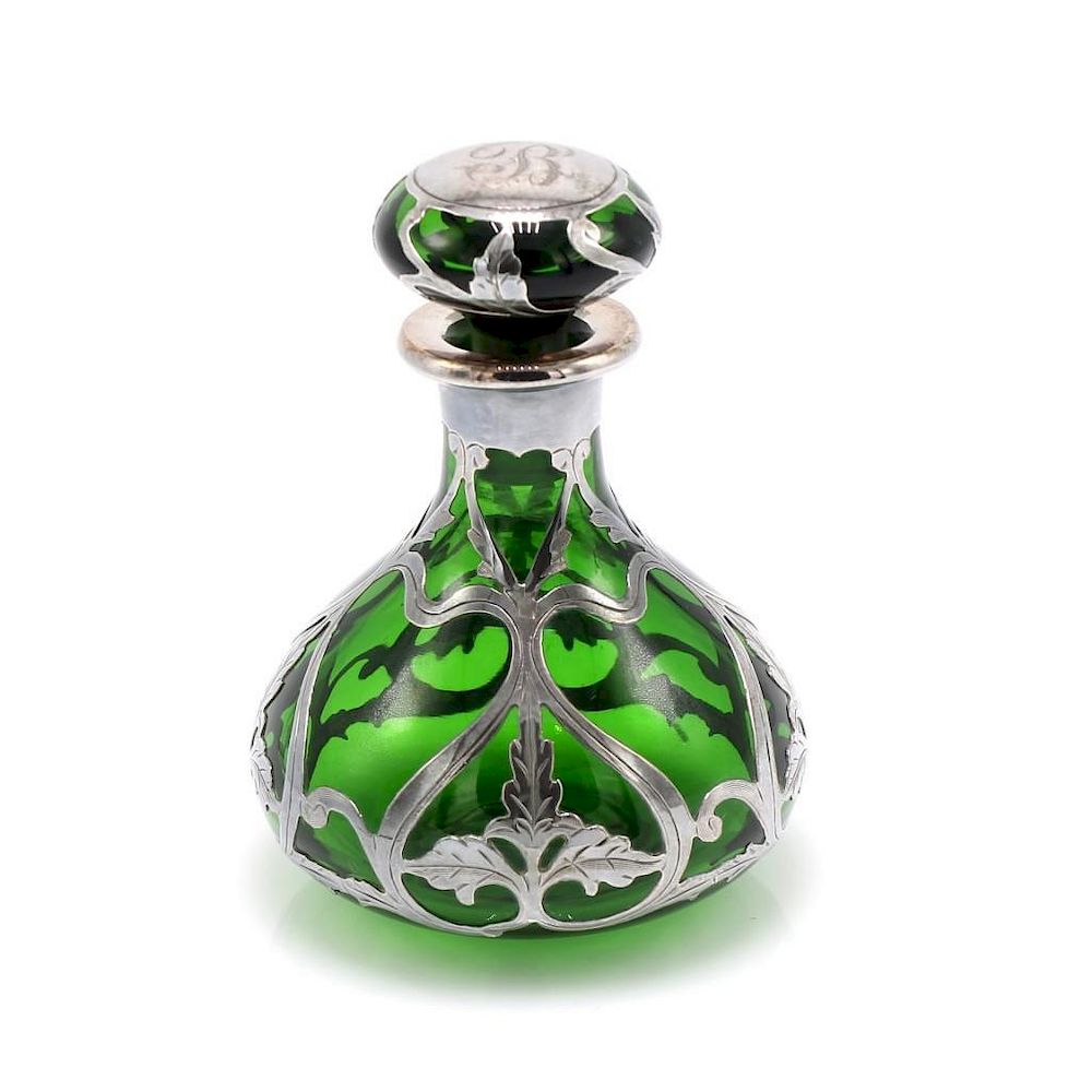 Appraisal: Green Perfume Bottle with Silver Overlay Green perfume bottle featuring