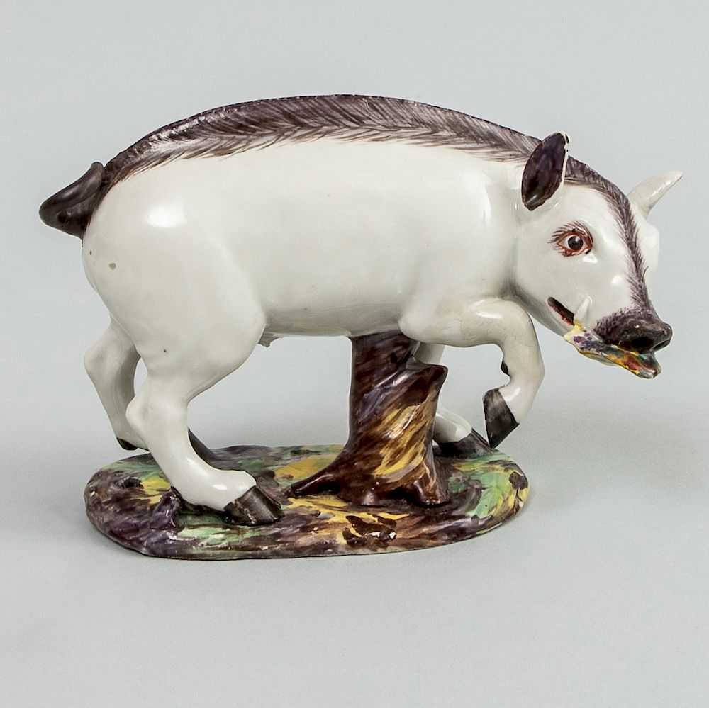 Appraisal: German Faience Model of a Boar Modeled with large leaf