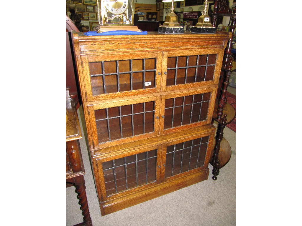 Appraisal: Oak and leaded glass sectional bookcase