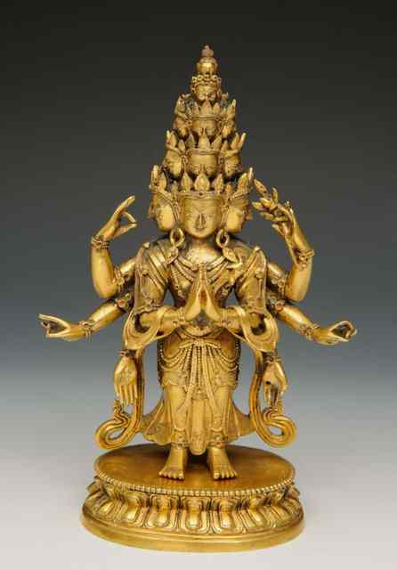 Appraisal: A SINO TIBETAN GILT BRONZE TANTRIC DEITY of multi-headed form