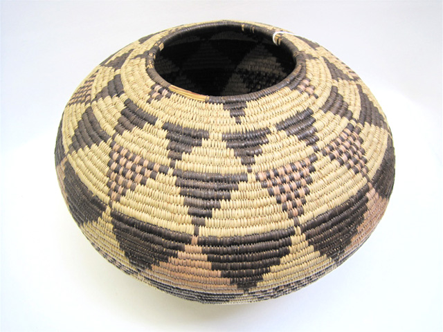 Appraisal: AN AFRICAN HAND WOVEN ROUND BASKET with repeating design Dimensions