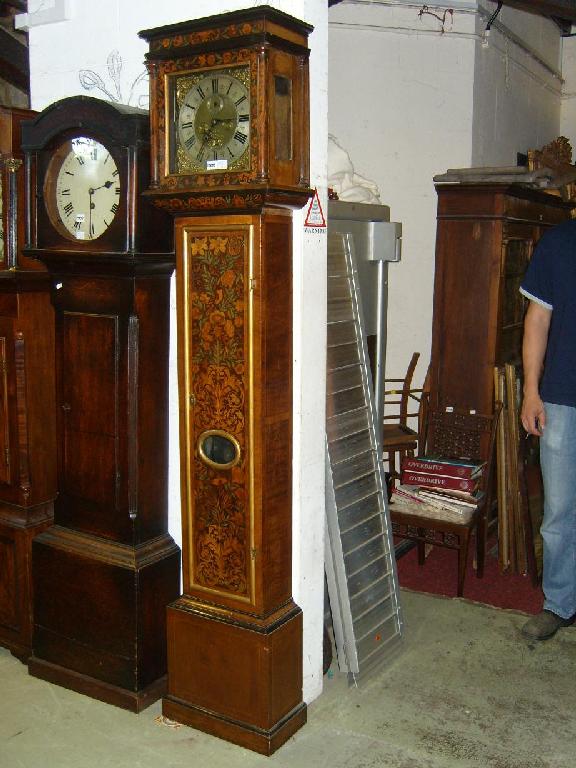 Appraisal: A walnut veneered longcase clock with full length door and