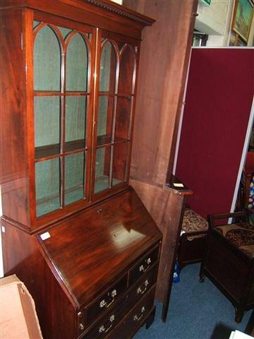 Appraisal: An Edwardian mahogany bureau bookcase standing on bracket feet wide