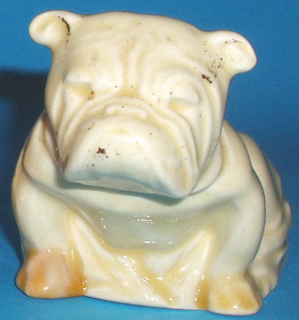 Appraisal: Miniature Size Seated Bulldog In All Over White Should Have