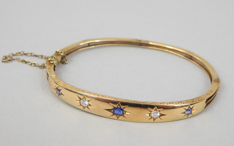 Appraisal: A Victorian bangle set with three sapphires and two diamond