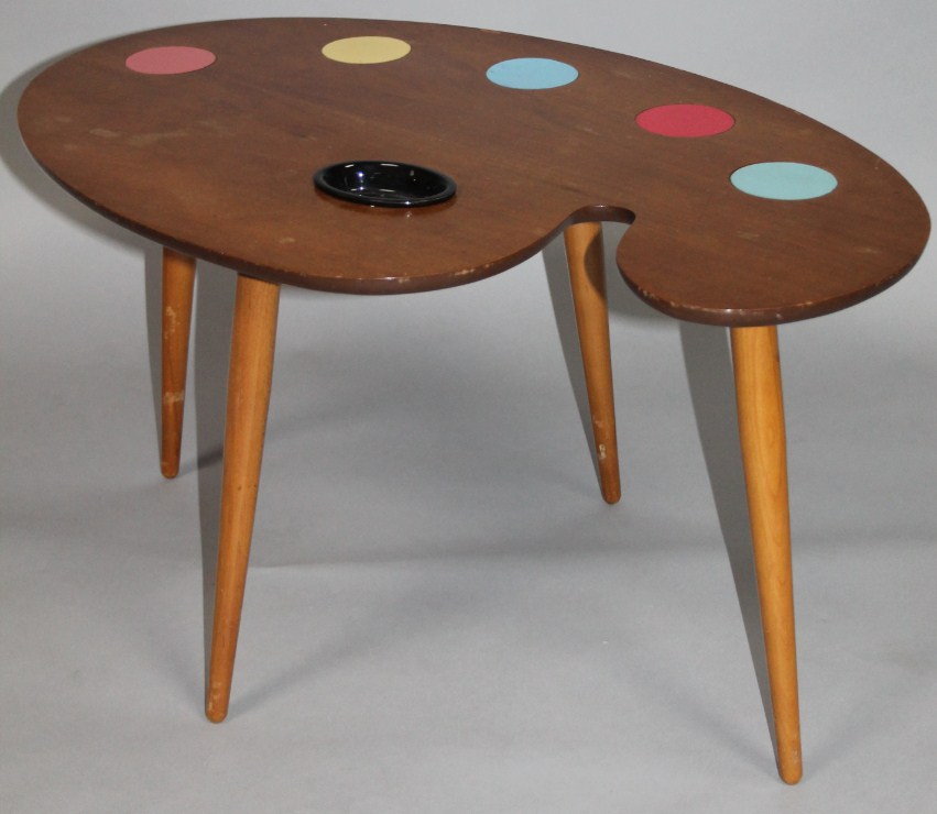 Appraisal: A 's retro teak coffee table the top formed as