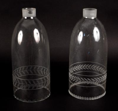 Appraisal: A pair of glass lantern chimneys with engraved borders cm