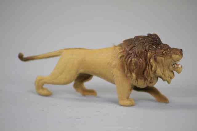 Appraisal: CHARGING LION DRESDEN ORNAMENT Germany features glass eyes exposed teeth