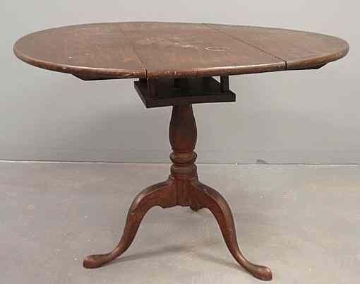 Appraisal: Pennsylvania walnut Queen Anne tea table with birdcage support and