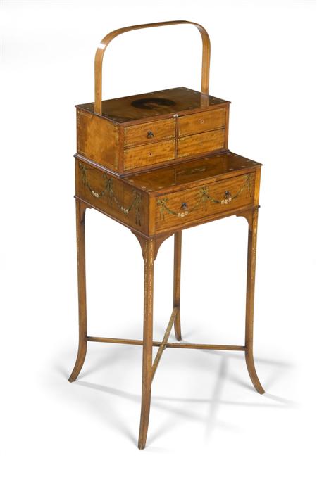 Appraisal: An Edwardian satinwood and painted work table the rectangular top