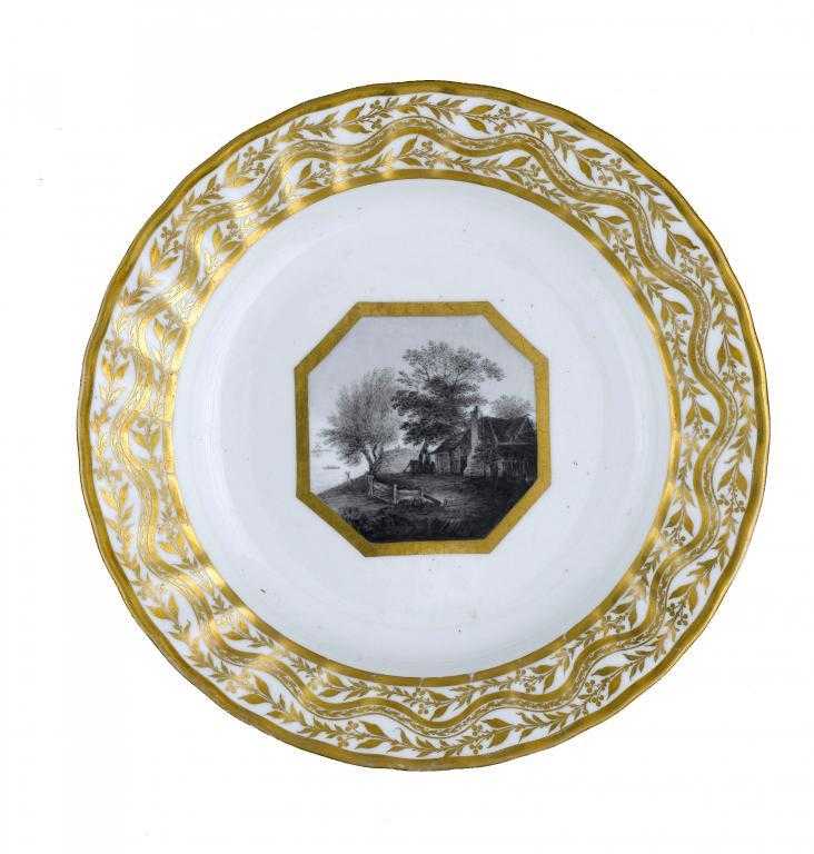 Appraisal: A DERBY PLATE painted en grisaille with buildings and trees