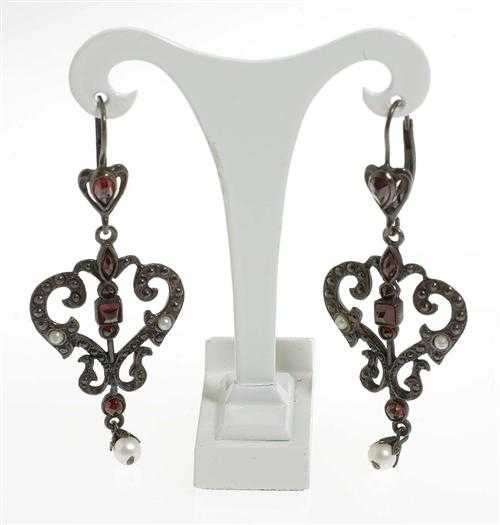 Appraisal: SILVER AND GARNET PENDANT EARRINGS Fancy amphora-shaped pendant earrings decorated