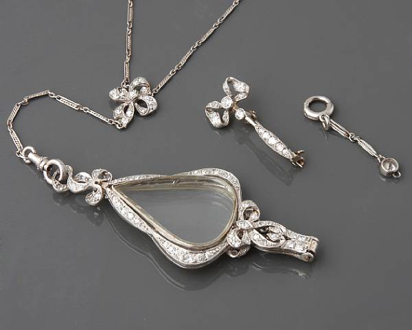 Appraisal: A platinum white gold and diamond lorgnette with detachable brooch