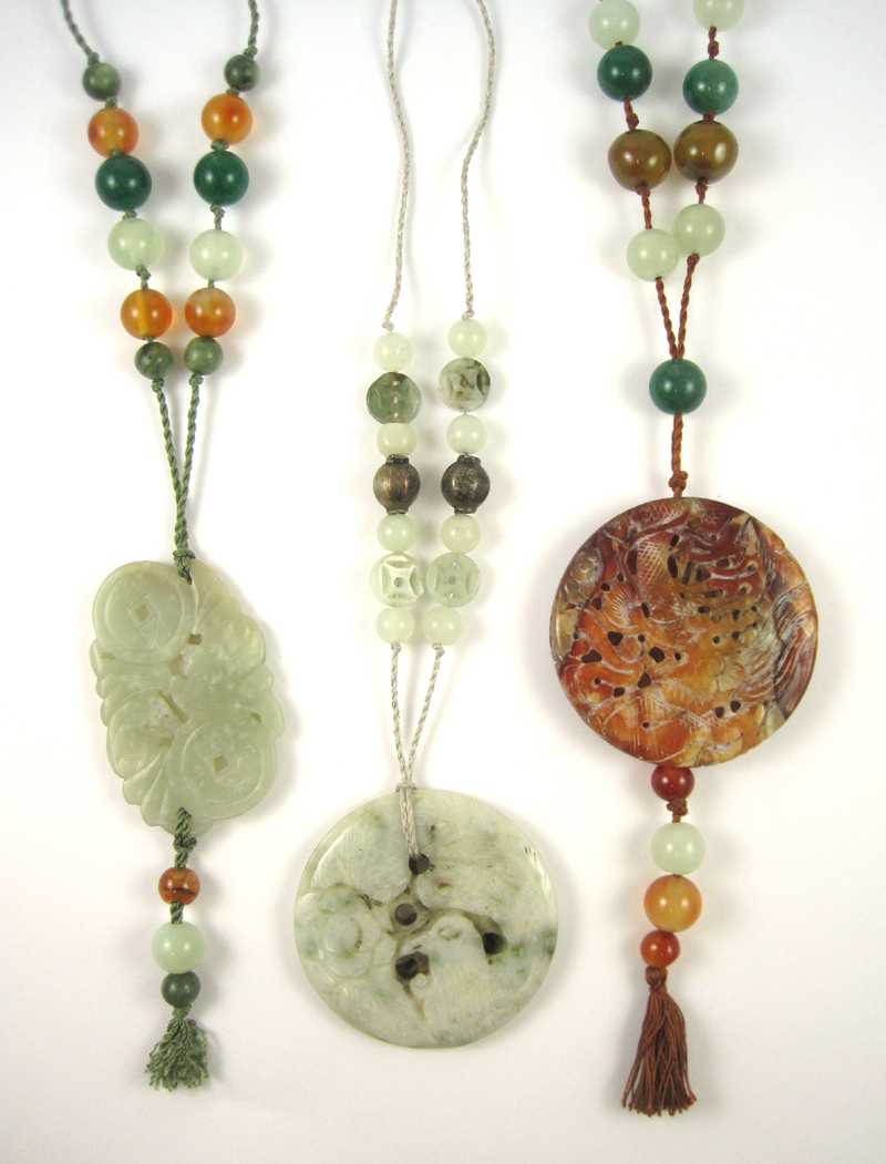 Appraisal: THREE CHINESE JADE NECKLACES one necklace strung with nine round