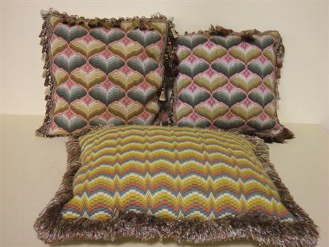 Appraisal: THREE WOOL BARGELLO PILLOWS The pair stitched in tones of