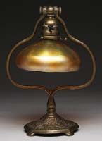 Appraisal: BRONZE TIFFANY HARP-SHAPED DESK LAMP WITH ASTROLOGICAL SYMBOLS Having a