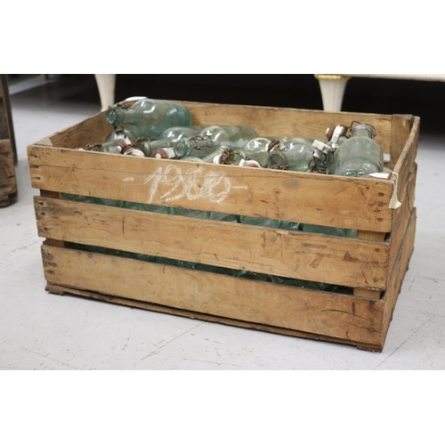 Appraisal: Vintage French wooden crate with glass bottles