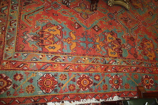 Appraisal: A LARGE TURKEY PALE BLUE GROUND CARPET decorated three rows