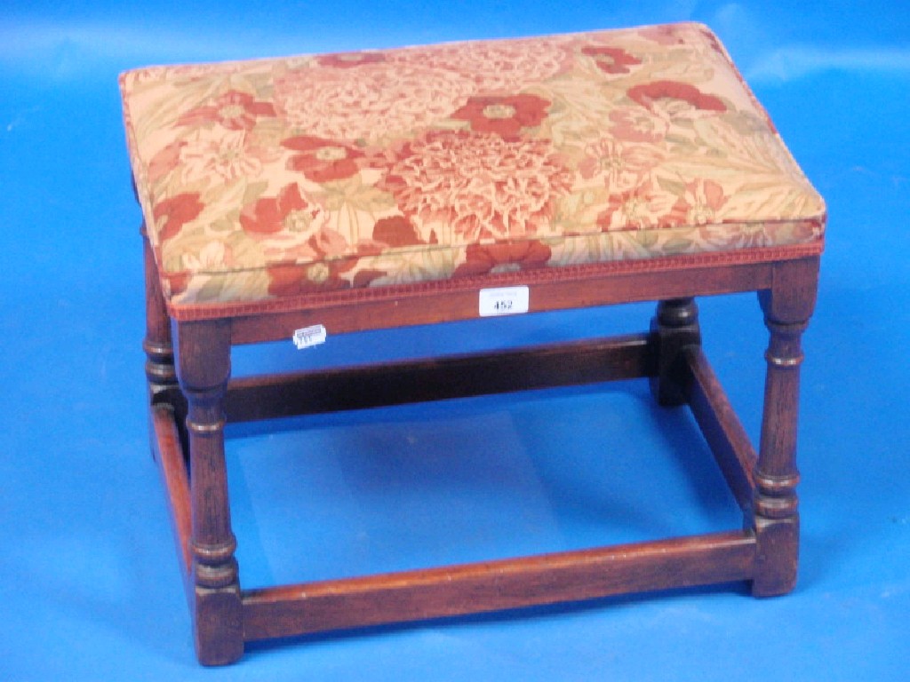 Appraisal: An oak jointed stool with sprung upholstered seat on turned