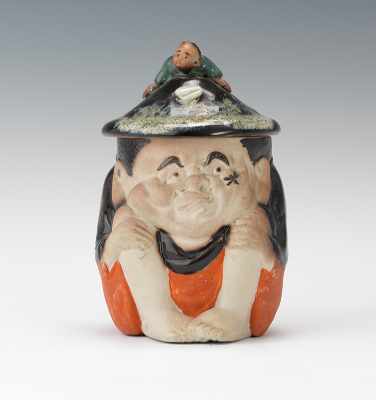 Appraisal: A Sumida Figural Tobacco Jar Pottery jar with polychrome glazes