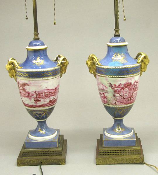 Appraisal: A pair of S vres style porcelain urns now as