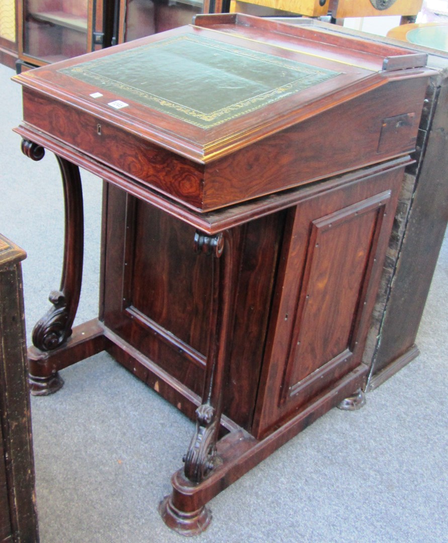 Appraisal: A th century rosewood Davenport the slope front with fitted