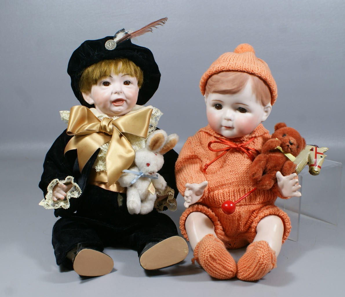 Appraisal: Reproduction German Character Babies boy in black velvet suit reproduction