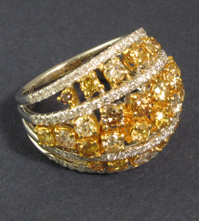 Appraisal: DIAMOND AND FOURTEEN KARAT GOLD RING set with round-cut yellow