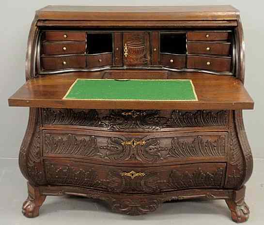 Appraisal: Continental oak bomb two-part roll-top desk th c with ornate