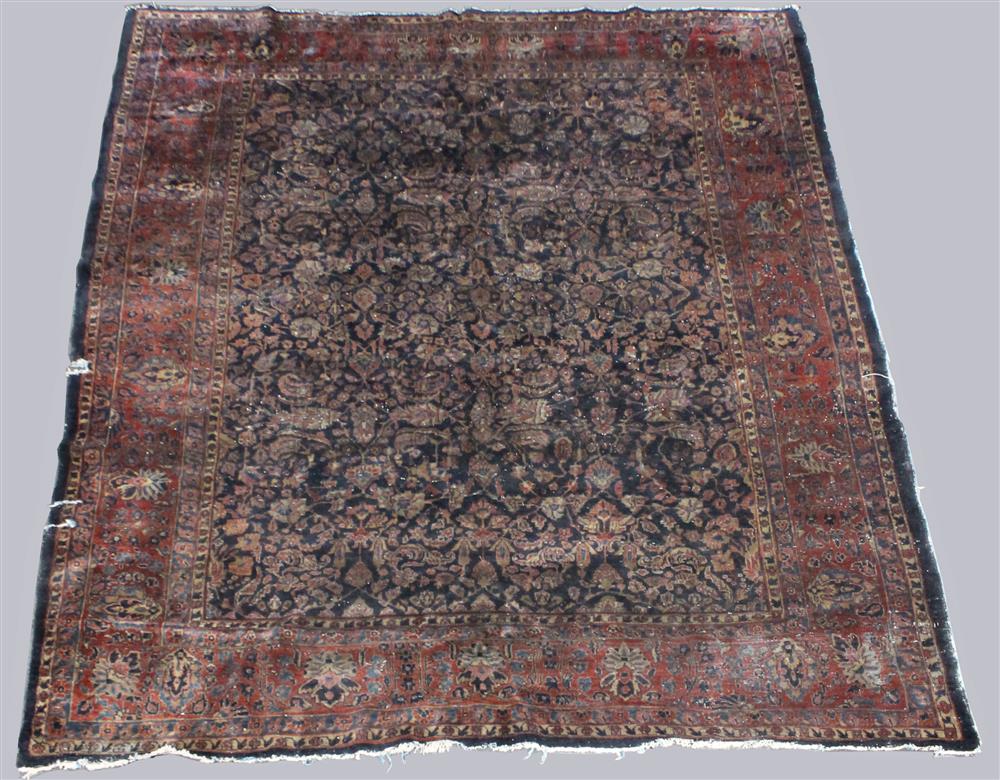 Appraisal: LARGE ANTIQUE SAROUK WOOL RUG floral design on a deep