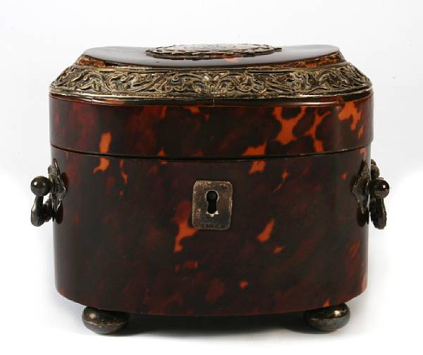 Appraisal: A white metal mounted tortoiseshell oval tea caddy height in