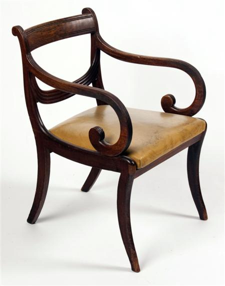 Appraisal: A Regency mahogany open armchair with tablet top-rail over reeded