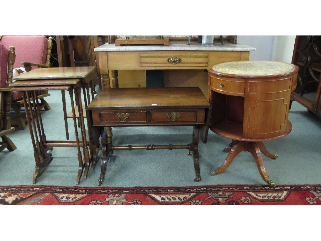 Appraisal: Mahogany nest of three tables swivel drum table sofa style