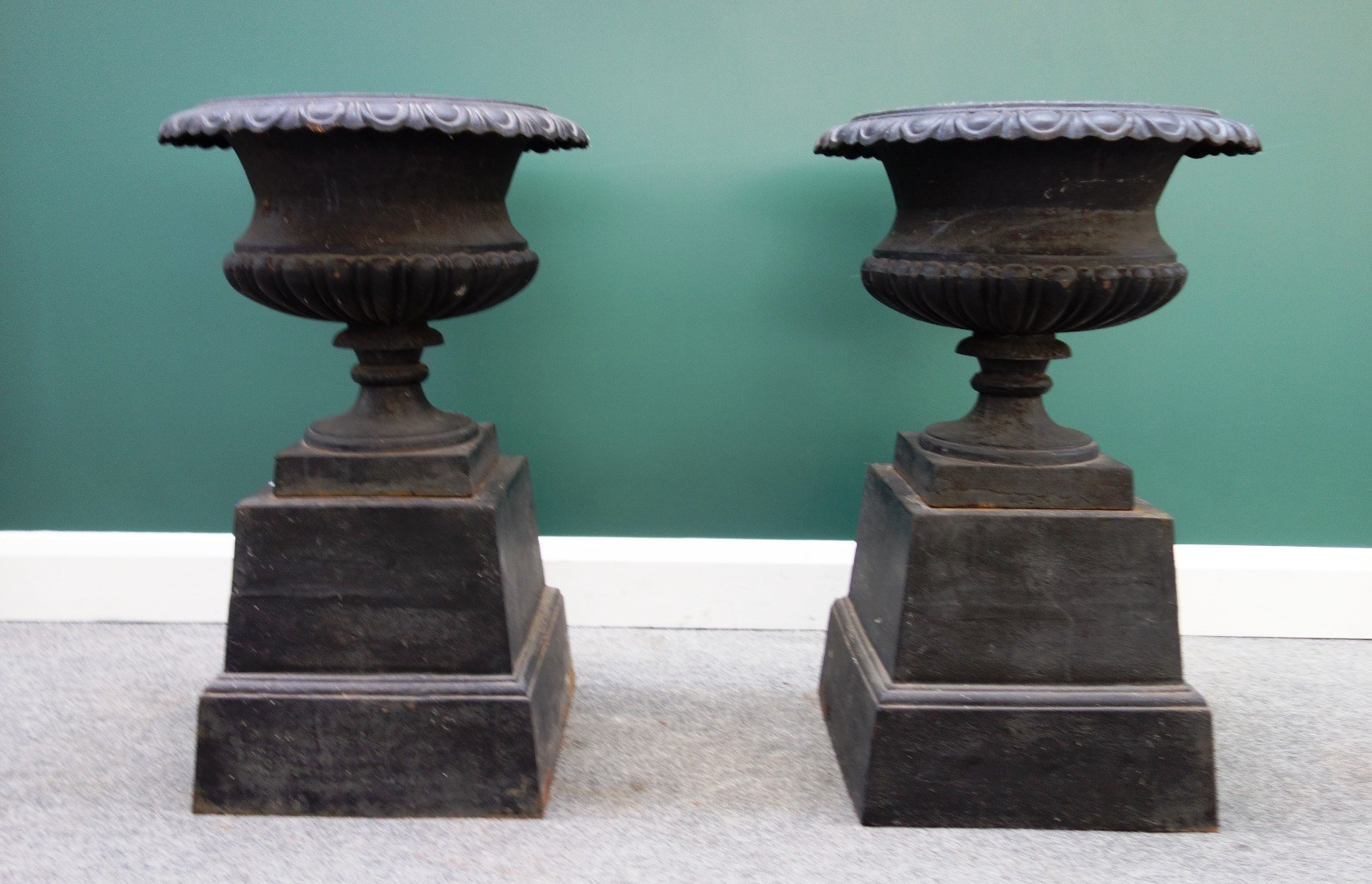 Appraisal: A pair of black painted cast iron jardinieres each with