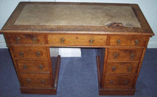 Appraisal: A Victorian oak pedestal desk the three frieze drawers above