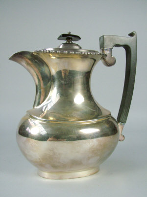 Appraisal: A silver teapot Sheffield with ebony finial and handle with