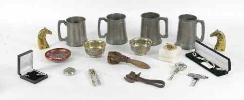 Appraisal: Four pewter mugs two nut crackers a bottle opener two