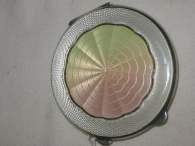 Appraisal: AN ART DECO ENAMELLED COMPACT of circular form with pale