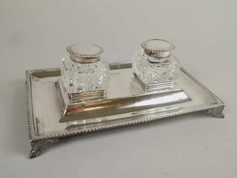 Appraisal: An early Edwardian silver ink stand the rectangular plate with