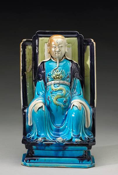 Appraisal: A fahua style glazed porcelain figure of Zhenwu Qing Dynasty