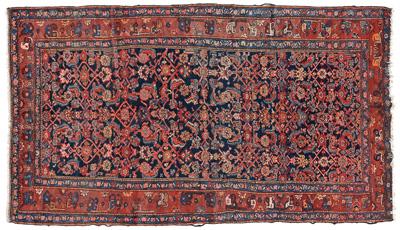 Appraisal: Persian rug repeating floral designs on dark blue field possibly