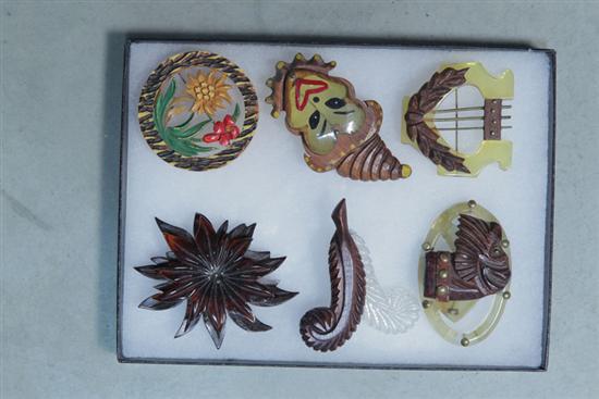 Appraisal: SIX VINTAGE PINS Bakelite and wood flower ''w Lucite or